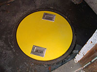 Custom Manhole Covers - 9 (Description: Drafting Technician Jennifer Stalnaker says We installed the covers and they are great! They asked for light weight covers that were safety yellow because the manholes were accessed frequently.)