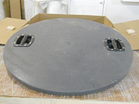 Custom Manhole Covers - 18 (Description: This custom gray cover has fiberglass handles to prevent any possible conductivity of electricity from the contents of the manhole.)