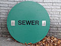 Custom Manhole Covers - 42 (Description: This 40.5 inch green sewer cover that is 38 pounds, is replacing a 185 pound cover. Across the country 'easy lift' covers are now being used where readings are required.)